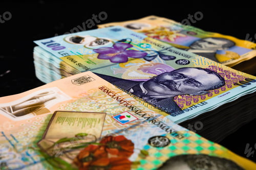 Preview: Closeup of the Romanian LEI bill piles on a black background