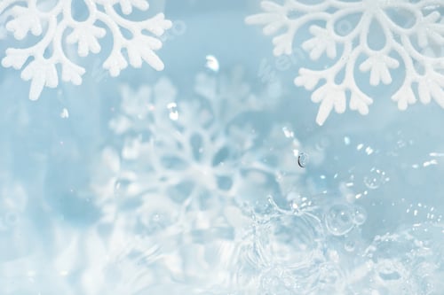 Preview: snowflake melts in water drops macro background