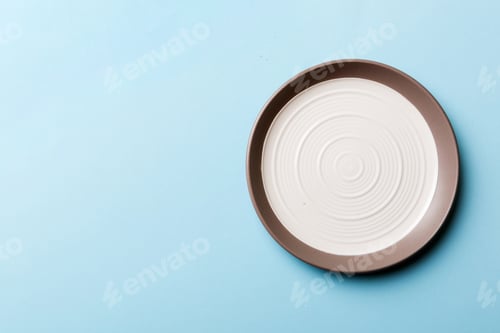 Preview: Top view of isolated of colored background empty round white plate for food.