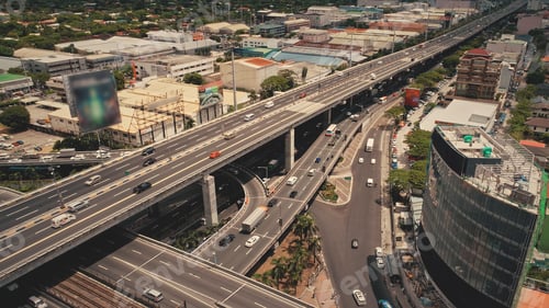 Preview: Modern skyscraper at traffic road with cars. Manila downtown aerial. Cityscape advertising billboard