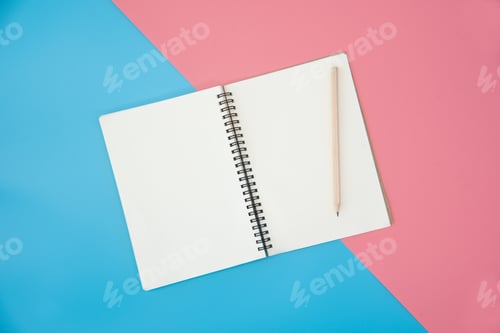 Preview: blank notebook with pencil on color background