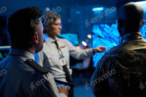 Preview: Backs of intercultural male officers