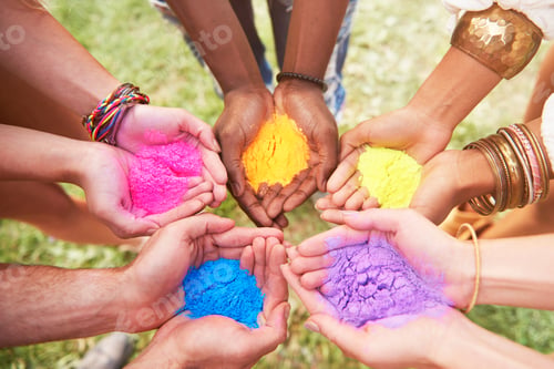 Preview: Group of friends at festival, holding colourful powder paint in cupped hands, close-up