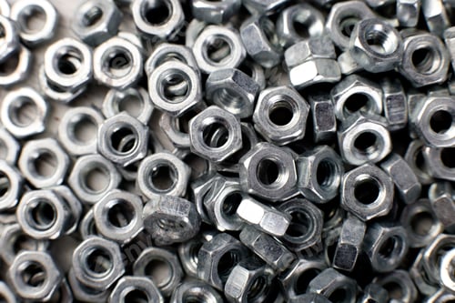 Preview: Metal nuts background. Macro. Working tools. Fixing elements.