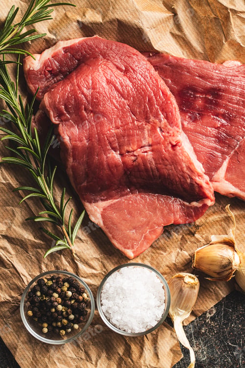 Preview: Raw veal schnitzel.