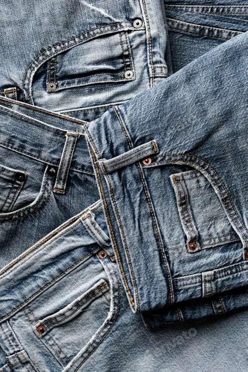 Preview: Group of aged blue denim jeans