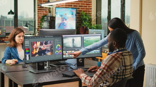 Preview: Diverse videographers editing creative film montage on software