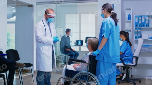 Preview: Discussing with disabled senior woman during COVID pandemic