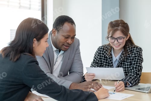 Preview: Multiethnic colleague gather in boardroom brainstorm analyst company financial paperwork together