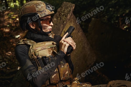 Preview: Woman in protective glasses and military uniform
