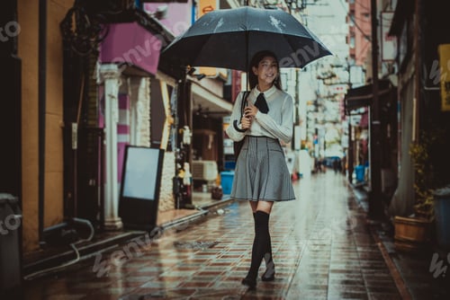 Preview: Beautiful japanese girl walking in Tokyo. Concept about teenagers and school