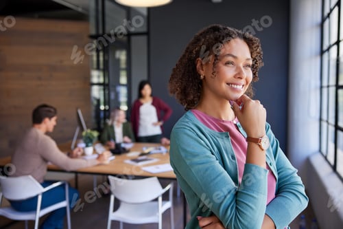 Preview: Thoughtful smiling businesswoman in office