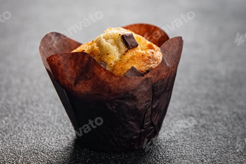 Preview: Delicious Golden Chocolate Chip Muffin Close Up