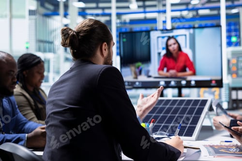 Preview: Solar panel factory management doing videocall with investors to show report
