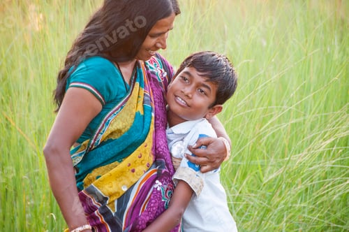 Preview: Indian mother having fun with her son and Playing in the field at morning.