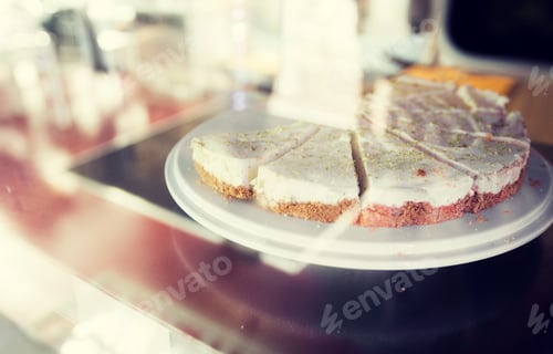 Preview: close up of cake on stand in cafe showcase