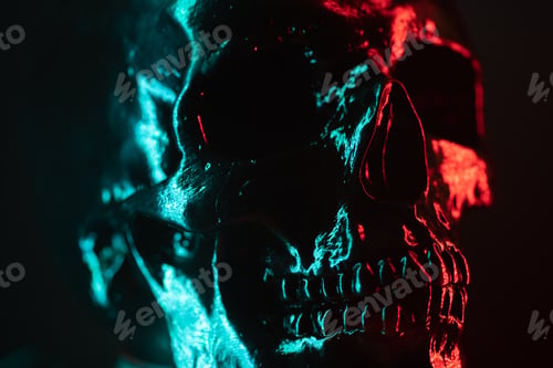 Preview: human skull head close-up. Neon turquoise and red light. Spooky and sinister. Glamour, disco,