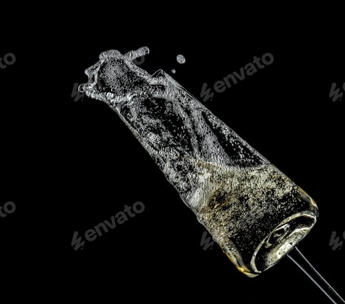 Preview: Glass of champagne on black background. Festive drink