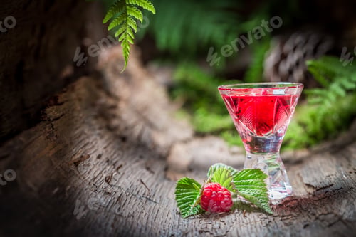 Preview: Raspberries liqueur made of fruits and alcohol in summer