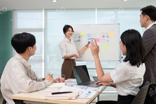 Preview: team of Asian businessmen meets to brainstorm ideas about office work management in an office