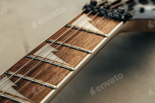 Preview: Guitar fingerboard with strings close up photo
