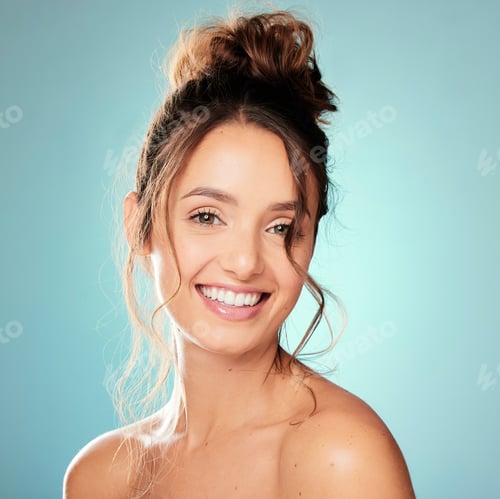 Preview: Studio portrait of an attractive young woman posing against a blue background