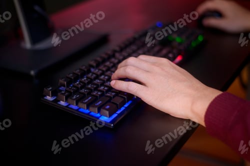 Preview: Close up human hand is playing Online Game computer in home