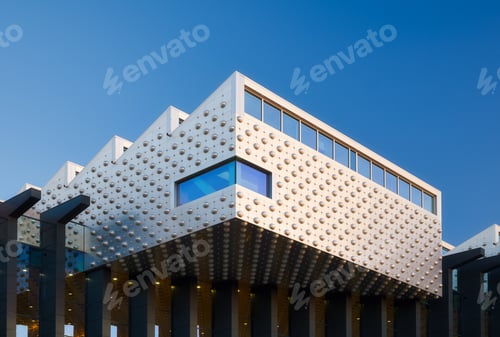 Preview: Architecture and design. Modern buildings. Metal and glass. Evening lighting in the city.