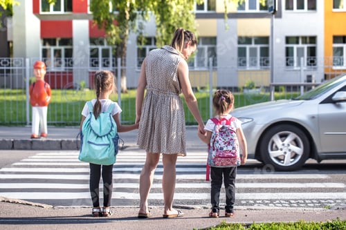 Preview: Girl kids, elementary students, carrying backpacks going to class