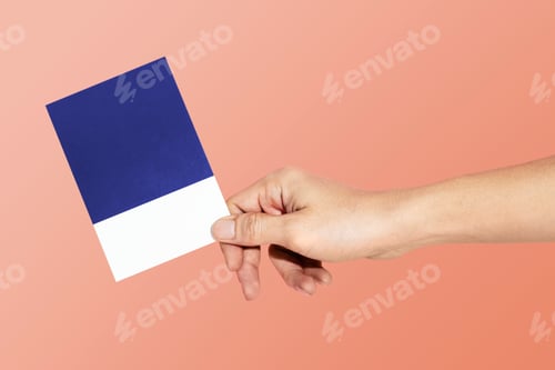 Preview: Hand holding a paper