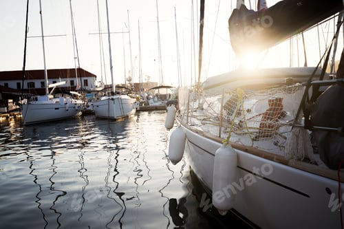 Preview: Picture of row of sailboats reflected in water