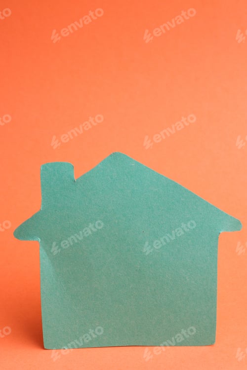 Preview: Green color house shape on orange background.