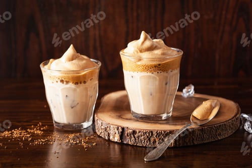 Preview: dalgona coffee in glass. trendy Instant coffee whipped with sugar and hot water