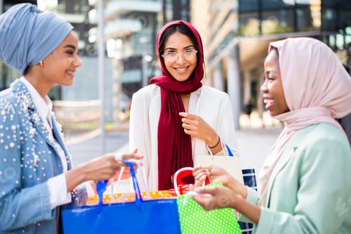 Preview: Beautiful muslim girl wearing hijab bonding outdoors
