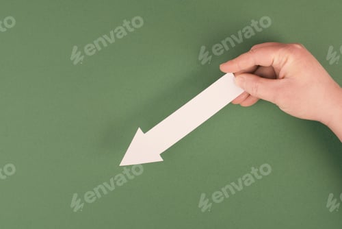 Preview: Holding an arrow in the hand, showing down, negative evaluation, financial recession