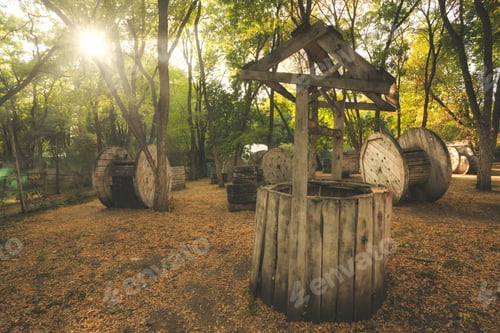 Preview: The old broken well was used as a fence at the paintball base