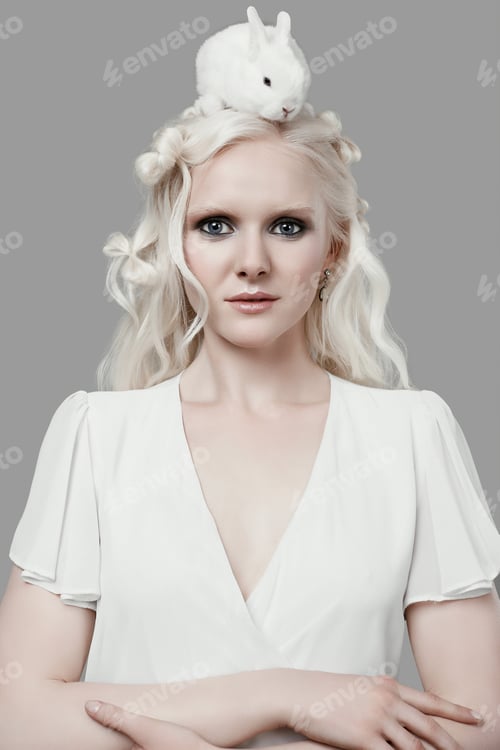 Preview: Fashion Portrait Of Albino Blond Girl With White Skin And Blue Eyes In Elegant Dress Posing With