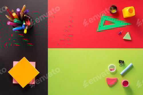 Preview: school supplies at abstract colorful background