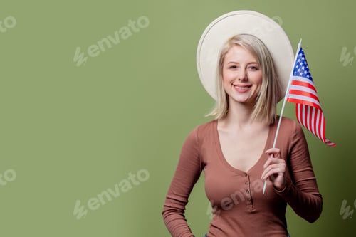Preview: Beautiful cowgirl in a hat with United States of America flag