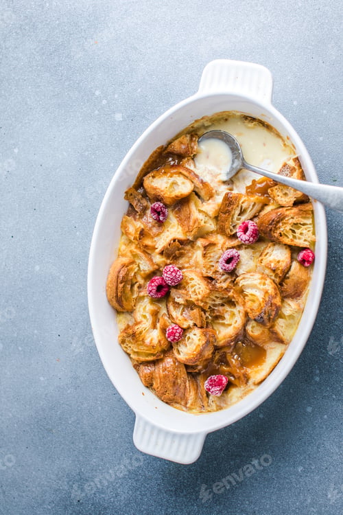 Preview: Croissant bread pudding with custard creamy sauce and vanilla ice cream very delicious dessert