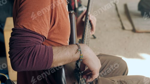 Preview: Musician playing on guitar