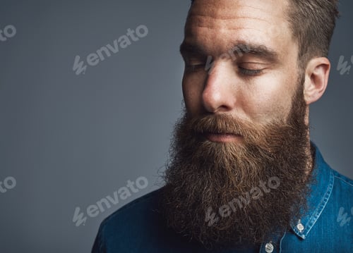 Preview: Bearded man in blue denim with eyes closed