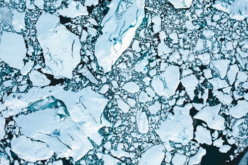 Preview: Overhead Aerial Shot of Ice Floes in Beautiful Blue Color shot in Iceland in Winter