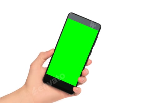 Preview: Smartphone with blank green display in female hand on white background, isolate