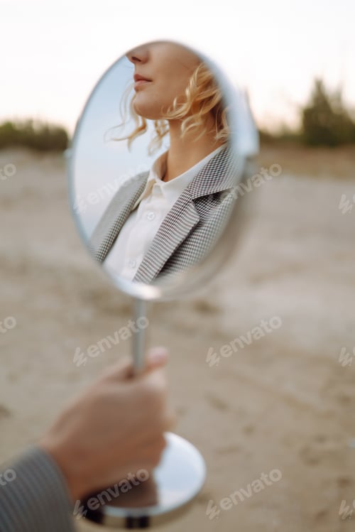Preview: Fashion Model posing near the sea. Young woman resting in nature. People, lifestyle, relaxation.