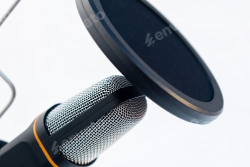 Preview: Closeup of a black and grey microphone captured on a white background