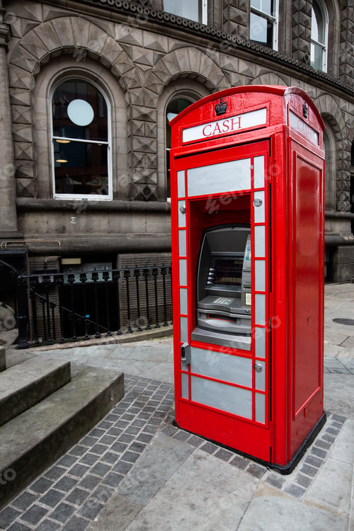 Preview: A red British telephone box repurposed as a cash machine