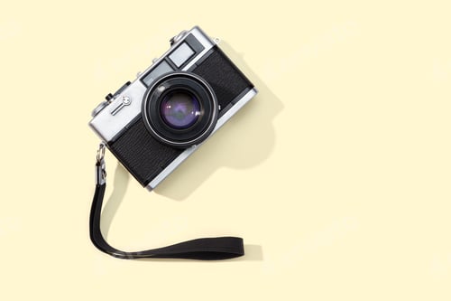 Preview: Flat lay film camera isolated on yellow background