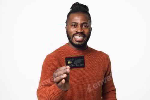 Preview: Smiling happy african-american young man holding credit card