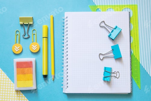 Preview: School supplies. Yellow and blue colors. Empty notebook. Flat lay composition. Space for text.